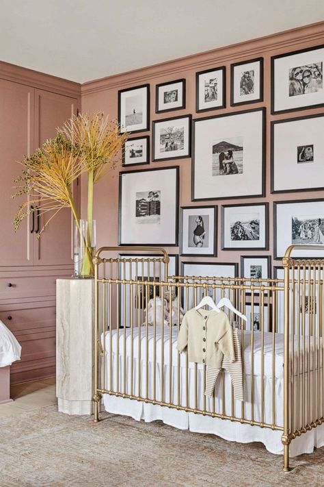 PHOTO: Shay Mitchell's Los Angeles home appears in Architectural Digest. Nursery Brass Crib, Brass Crib Nursery, Black White And Gold Nursery, Nursery Picture Wall, Brass Crib, Wall Of Paintings, Wall Of Pictures, Black And White Gallery Wall, Nursery Gallery Wall