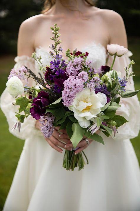 Bramble & Blossom's expertise lies in creating the perfect eco-friendly bouquets for Pittsburgh brides. Stacia's bouquet was the quintessential spring purple vibe, featuring lilac, lilac, tulips, ranunculus, lavender, delphinium, and clematis. Make your wedding day as unique and special as you are. Contact us today to book a free consultation! Photograph by Tara Bennett Photography Lilac And Peony Wedding Bouquet, Navy Lavender And Sage Wedding, Lilac Flower Bouquet Wedding, Boho Wedding Bouquet Purple, Wedding Spring Bouquets, White Bouquet With Purple Accents, Wedding Bouquets Bride Tulips, Lilac Green Wedding, Wedding Flowers With Lavender