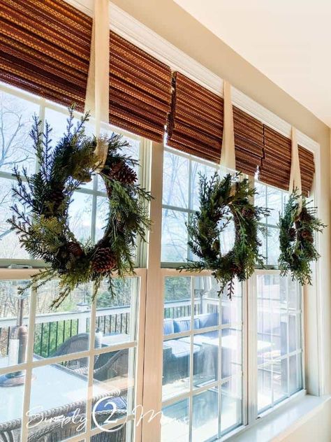 Window Sill Christmas Decorations, Christmas Decor Sunroom, Christmas Wreath Window Indoor, Wreaths Over Windows, Christmas Wreath Above Garage Door, Christmas Wreaths For Windows Inside, Christmas Wreaths On Interior Windows, Indoor Christmas Wreaths Window, Wreaths On Interior Doors