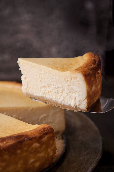 Classic New York Cheesecake is a heavenly cloud of silky perfection. Rich, creamy, and ethereally light, this tall and proud cheesecake is crowned with stunning browned edges and sits atop a buttery, crunchy shortbread crust. #cheesecake #newyork #classic #creamy #recipe #best #shortbread #baked #dessert Classic New York Cheesecake, Shortbread Cookie Crust, White Chocolate Raspberry Cheesecake, Chocolate Raspberry Cheesecake, Healthy Cheesecake, White Chocolate Cheesecake, Best Cheesecake, Shortbread Crust, New York Cheesecake