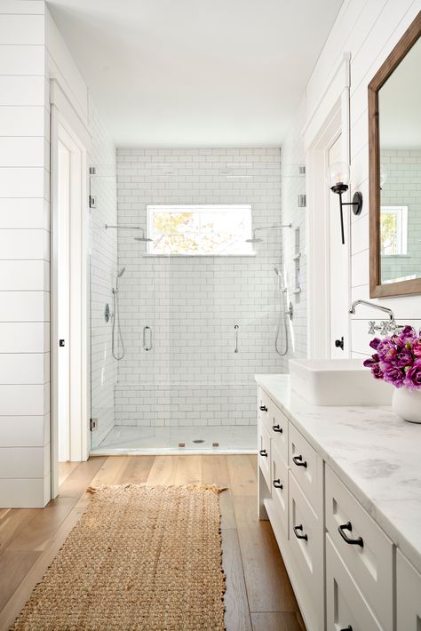 The Most Popular Flooring Trends of 2023 Bathroom White Cabinets Wood Floor, White Vanity Wood Floor Bathroom, Wood Floors In Bathroom Master Bath, Light Wood Flooring Bathroom, Shower Remodel Wood Floor, Bathroom Inspiration Wood Floor, Lvp Floors In Bathroom, Bathrooms Wood Floors, Master Bath Wood Tile Floor