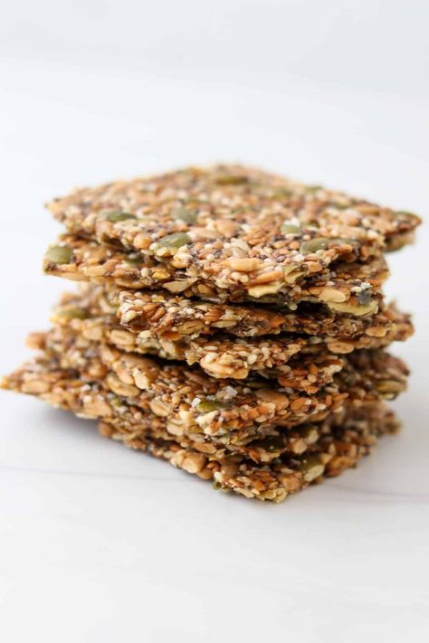 An ultra-crisp, gluten-free cracker made from seeds and cornstarch. Gluten Free Fruit And Nut Crackers, Norwegian Seed Crackers, Healthy Cracker Recipe, Norwegian Crispbread, Seedy Crackers, Gluten Free Carbs, Gf Crackers, Crispbread Recipe, Seeded Crackers