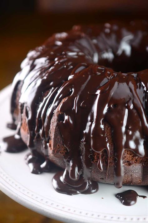 Chocolate cake studded with chocolate chips and drizzled with chocolate ganache. This Triple Chocolate Bundt cake is decadent, rich and luscious. Triple Chocolate Bundt Cake Recipe, Triple Chocolate Bundt Cake, Homemade Ganache, Chocolate Bundt Cake Recipe, Thanksgiving Side Dishes Healthy, Triple Chocolate Cake, Thanksgiving Appetizer Recipes, Chocolate Bundt, Bundt Cake Recipe