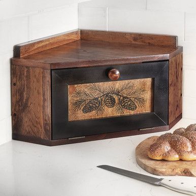 A Black Forest Decor Exclusive - This solid knotty pine corner breadbox offers ample storage to declutter your counters and a low profile for additional space above. Due to the nature of the wood, natural variations and imperfections will occur; each one is unique. Made in the USA. 24"W x 17"D x 12"H. Vintage Wood Decor, Witchy Cottage Decor, Witchy Kitchen Decor Ideas, Kitchen Corner Counter Decor, Cabincore Decor, Breadbox Ideas, Hobbit House Decor, Cottagecore Furniture, Cabincore Aesthetic