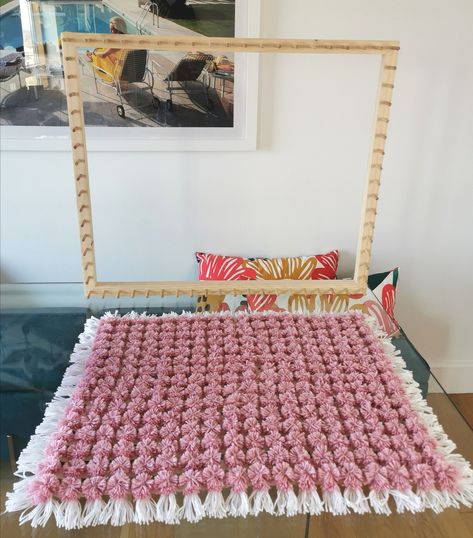 How to make a Pom Pom Blanket using a loom frame. Frame from Looming Mad Crafts on Etsy: www.etsy.com/uk/shop/LoomingMadCrafts #pompom #loom #pompomloom #pompomblanket #diyblanket #tutorial #crafts #diycrafts #easycrafts #beginnercrafts Pompom Rugs How To Make A, Pompom Blanket Frame, Loom Board Pom Pom Blanket, Pompom Blanket Loom, Loom Pom Pom Blanket, Pom Pom Blankets Tutorial, Pom Pom Baby Blanket Tutorial, Weaving Baby Blanket Loom, Pom Pom Loom Blanket