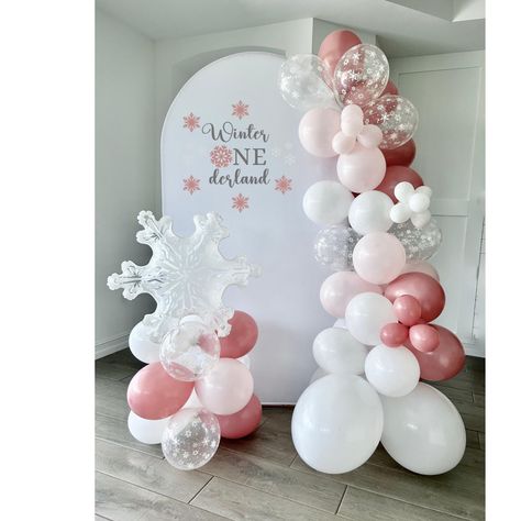 Welcome to Sweet Escapes By Debbie  This winter onederland DIY balloon garland is just the thing to make your little ones party special! This garland is a great way to add that pop to your party. Chose the length you would like at checkout. The garland includes white, pink, rose and clear with white snowflake balloons. Making your own backdrop has never been easier! With this complete kit you can make a beautiful statement piece that will wow your guests! The 6 foot garland is the perfect size t Pink Winter Wonderland Centerpieces, Winter Onederland Balloons, Snowflake Balloon Arch, Pink Winter Onederland Party, Winter Onederland Balloon Arch, Winter Onederland Centerpieces, Winter Wonderland Balloon Garland, Pink Winter Wonderland Party, Winter Wonderland Birthday Decorations