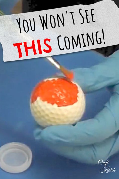 white golf ball being pained orange with a paint brush Golf Ball Decor, Upcycle Golf Balls, Crafts With Golf Balls, Painted Golf Balls Cute Ideas, Golf Balls Crafts Ideas, Golf Diy Crafts, Golf Tee Crafts, Painted Golf Balls, Golfball Crafts