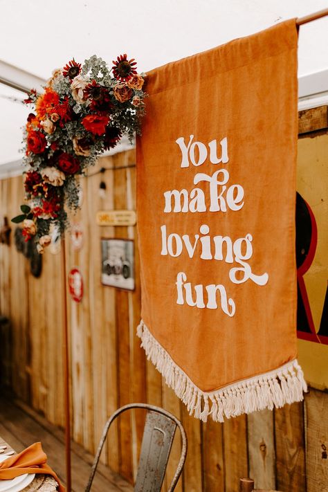 Orange Table Decor Banner Sign Boho Retro 70s Daisy Jones Six Wedding Ideas Caroline Opacic Photography #wedding #weddingdecor 70s Inspired Fall Wedding, 70s Fall Wedding, 1970s Wedding Decor, Retro Rustic Wedding, Fall Retro Wedding, Retro Wedding Arch, Stevie Nicks Wedding Theme, Retro Wedding Welcome Sign, 70's Wedding Inspiration