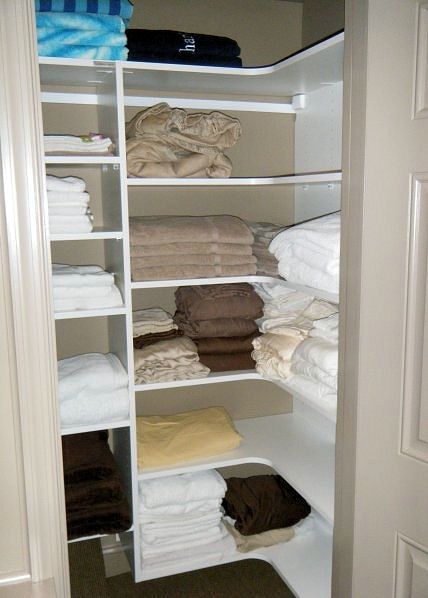 Shelves Corner Linen Closet Bathroom, L Shaped Linen Closet, Corner Linen Closet Organization, Closet With Corner, Corner Linen Closet, Closet Shelving System, Corner Closet Organizer, Spare Bedroom Closets, Pocket Doors Bathroom