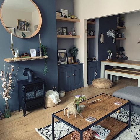 Love the blue in this living room with the rustic touches of wooden shelving, flooring and coffee table. #livingroom #livingroomideas #darkinteriors #rustic #rusticinteriors Shelves Scandinavian, Dark Wood Living Room, Blue Walls Living Room, Wooden Shelving, Dark Blue Living Room, Navy Living Rooms, Ideas Habitaciones, Bank Balance, Blue Living Room Decor