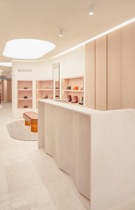 BIMANI Store in Valencia by CuldeSac Interior Design Boutique, Shoe Store Design, Retail Store Interior Design, Large Curtains, Beige Marble, Retail Store Design, Boutique Interior, Retail Interior, Store Design Interior