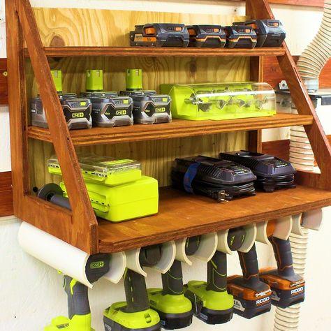 Here is a simple custom storage solution for some of your cordless drills, batteries, and chargers. It was built with 3/4" plywood and pvc pipe. Drill Battery Storage, Pvc Cordless Tool Storage, Drill And Battery Storage, Diy Drill Charging Station, Diy Cordless Tool Storage, Battery Storage Ideas, Cordless Tool Storage, Arbejdsplads Garage, Charging Station Ideas