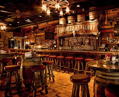 Interior Design Ideas Using Squirrel Cage Light Bulbs Country Bar Decor, Country Bar Design, Cowboy Restaurant Design, Country Bar Ideas, Cowboy Interior Design, Cowboy Restaurant, Barrel Tables, Rustic Bar Decor, Cowboy Bar