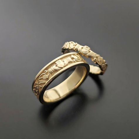 An original design by goldsmith Eileen at Claddagh Design Irish jewellery. This unique set of Claddagh wedding rings incorporate heart, hands and crown for love, friendship and loyalty. These beautiful bands feature intricate detailing inspired by nature. Finely crafted in Ireland, made to last  #claddaghweddingrings #customrings #irishwedding #claddaghrings Claughdaugh Engagement Ring, Antique Wedding Ring Set, Claddagh Ring Wedding Band, Irish Wedding Band, Claghda Ring, Claddagh Ring Aesthetic, Claddagh Wedding Bands, Unique Claddagh Ring, Engagement And Wedding Ring Sets