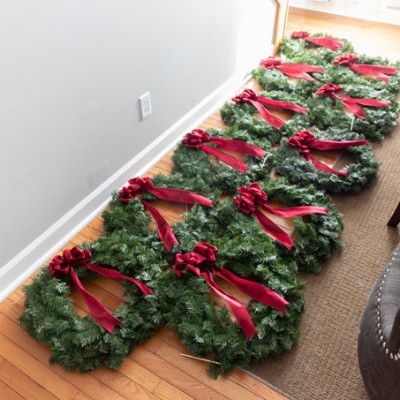 Outdoor Window Wreaths For Christmas, Outdoor Christmas Window Wreath Ideas, Wreath On Window Outdoor, Xmas Garland Ideas Diy, Wreath With Red Ribbon On Window, Small Window Wreaths Christmas, Wreath On Every Window, Outdoor Wreaths On Fence, Wreaths On All Exterior Windows