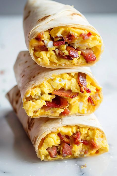 Loaded with fluffy, cheesy scrambled eggs and topped with perfectly crispy bacon, these bacon and egg breakfast wraps are comfort food at its best. Egg Bacon Breakfast Ideas, Turkey Bacon Breakfast Burrito, The Perfect Breakfast, Breakfast Fajitas Eggs, Breakfast Sale Ideas, Scrambled Eggs Wrap, Bacon Egg And Cheese Breakfast Burrito, Bacon Egg And Cheese Wrap, Meal With Eggs