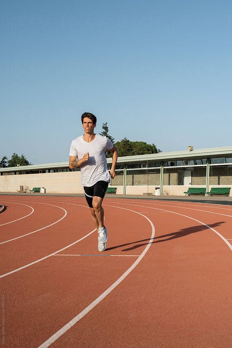 Focused Sportsman Running On Track During Workout | Stocksy United Running On Track, Running Pose, Marathon Training Schedule, Running Photography, Person Running, Running Photos, Interval Running, Running Day, Marathon Training Plan