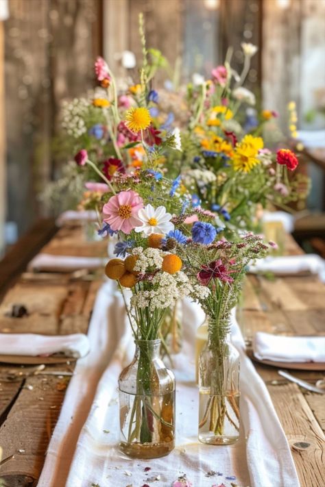 Flower Garden Wedding Decor, Fruit And Flower Table Decor, Wildflower Long Table Wedding, Colorful Wild Flower Wedding, Summer Garden Table Setting, Springtime Wedding Ideas, Wild Flower Backyard Wedding, Boho Wildflower Wedding Table Decor, Colorful Flower Wedding Theme