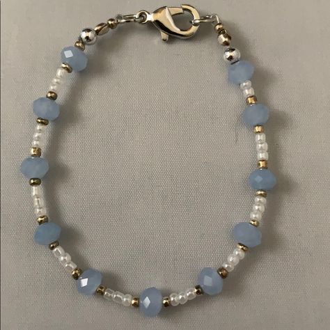 Handmade By Me, A Blue, White And Gold Small Bead Bracelet Accented In Silver. Bracelet Is 6 3/4” Long. Coastal Grandmother Aesthetic Jewelry, Blue And Silver Beaded Bracelets, Concert Bead Bracelets, A Bracelet Handmade, Gold And Silver Beaded Bracelets, Blue And White Seed Bead Bracelet, Basic Beaded Bracelet, Black White Beaded Bracelet, Cute Blue Bracelet Ideas