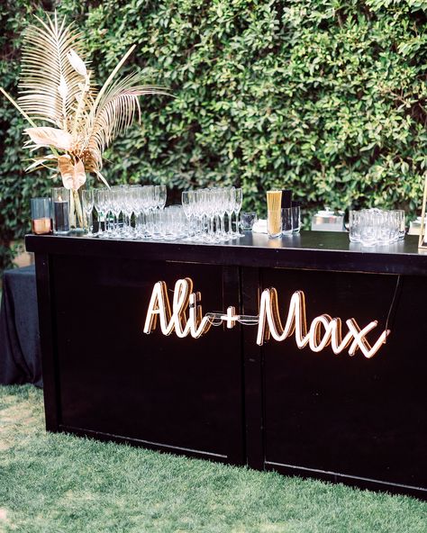 Customize your cocktail hour by hanging a neon sign (this one is by Echo Neon) that features your names on the front of your wedding bar. #Wedding #WeddingSigns #NeonSign #WeddingIdeas #Unique #Modern #WeddingTrends | Martha Stewart Weddings - 20 Ways to Use Neon Signs to Light Up Your Wedding Spring Wedding Cocktails, Wedding Cocktail Bar, Wedding Themes Spring, Rustic Wedding Decorations, Cocktail Hour Wedding, Palm Springs Wedding, Bar Set Up, Neon Wedding, Beach Theme Wedding