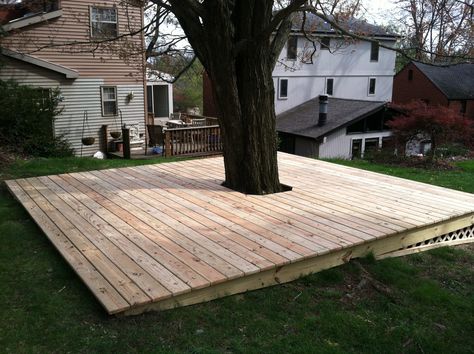 Lattice to keep stuff from going under the deck... Tree In Decking, Decks Around Trees, Deck Under Tree, Under Tree House Ideas, Deck Around A Tree, Backyard Deck Around A Tree, Deck Around Tree Ideas, Tree Deck Platform, Deck Around Tree