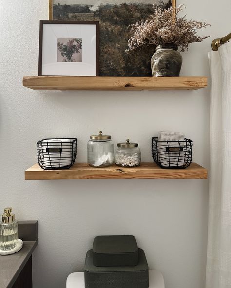 A little bathroom shelf refresh! Swapped out some storage containers, moved around some decor from other rooms, & voila-this space now feels fresh and new without spending a fortune! Comment SHOP below to receive a DM with the link to shop this post on my LTK ⬇ https://liketk.it/4OV2A . . . . #mixerofstyles #interiordesign #hometakestime #transitionaldesign #mydomaine #wearevivir #mycrumbshome #bathroomdesign #shelfie #bathroomdecor #bhghome #bhgstylemaker #interiorstyling #theeverygirlatho... Bathroom Shelves By Tub, Shelves About Toilet, Bathroom Shelf Over Toilet, Bathroom Shelving Above Toilet, 2 Shelves Above Toilet, Shelf Decor In Bathroom, Modern Organic Bathroom Shelves, Top Of The Toilet Decor, Rustic Bathroom Shelf Decor