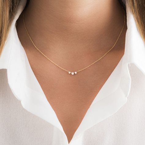 Our delicate round diamond necklace makes the perfect accessory! This dainty diamond necklace features 3 round brilliant cut prong set diamonds along with a sturdy 1.3mm cable chain and spring clasp for additional security. Our meaningful diamond necklace is available in three different 14K Gold colors: White Gold and Yellow Gold. ✨ Features ✨ • Ready To Ship. • Made in the USA.• Gold : Solid 14K• Choice of Gold: Yellow Gold, White Gold• Diamond Cut: Round • 3 VS quality Genuine Diamonds• Packag Dainty Gold Necklace Simple & Dainty Jewelry, Round Diamond Necklace Settings, Earring Necklace Ring Set, Fine Necklace Gold, Small Diamonds Necklace, Minimalistic Diamond Necklace, Simple Gold Diamond Necklace, Dainty Everyday Necklace, Three Diamond Necklace