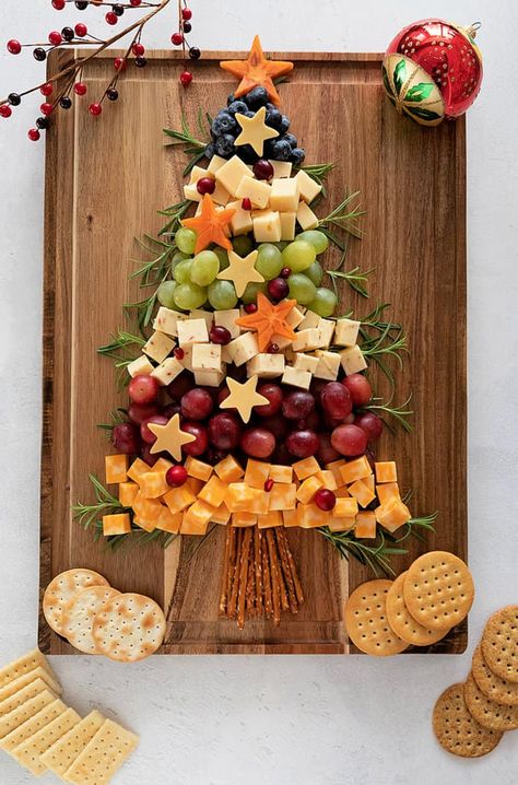 A Christmas Tree Shaped Charcuterie board will be a show stopper at any party and the ingredient options are almost endless. #recipes #holidayfood #christmastree #charcuterie #cheese Fruit Tree Charcuterie Board, Xmas Tree Charcuterie Board, Tree Shaped Charcuterie Board, Charcuterie Tree, Christmas Tree Charcuterie Board, Christmas Cheese Boards, Class Mom, Christmas Charcuterie Board, Toddler Nutrition