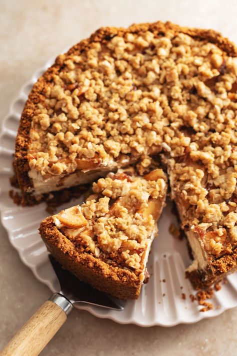 This apple crumble cheesecake is made with a biscoff cookie crust, creamy spiced cheesecake topped with tender cinnamon apples, and a crumble topping. It's the perfect rich and delicious Fall cheesecake! #applecrumble #cheesecake #fallbaking | teakandthyme.com Apple Crumble Cheesecake, Crumb Topping Recipe, German Pastries, Crumble Cheesecake, German Word, Apple Cheesecake, Apples And Cheese, Streusel Topping, Crumble Topping