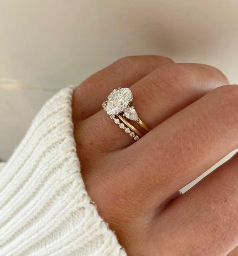 Engagement Setting Ideas, Wedding Band With 3 Stone Ring, Wedding Bands Three Stone Ring, Three Rings Wedding Set, Wedding Band Three Stone Ring, Wedding Bands For Oval Diamond, Oval With Pear Side Stones With Wedding Band, Platinum Gold Rings, Oval Ring With Side Stones And Wedding Band