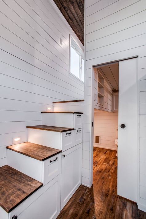 34' Magnolia Homesteader is a gorgeous modern tiny home on a triple axle with a private stand-up loft bedroom, large bathroom, and more! The kitchen has full-sized appliances, a built-in living room slide-out sofa, and two loft spaces. A perfect family tiny home! Split Level Stairs, Apartment Size Refrigerator, Tiny House Vacation, Tiny House Builders, White Shiplap Wall, Tiny House Inspiration, Modern Tiny House, Farmhouse Sink Kitchen, Tiny Spaces