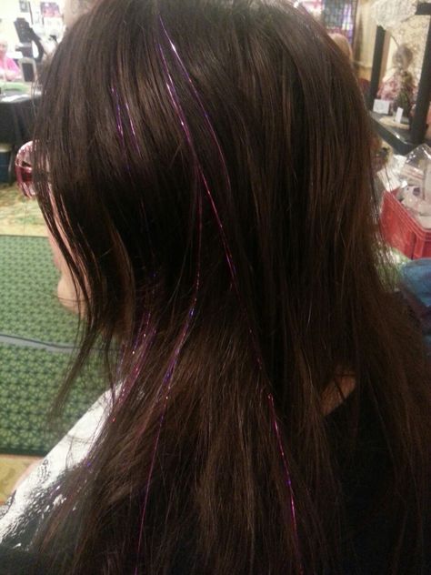 Purple in Brown Brown Hair With Glitter Strands, Purple Tinsel In Brown Hair, Purple Hair Tinsel Brunette, Pink Tinsel In Brown Hair, Purple Tinsel Hair, Brown Hair Tinsel, Dark Brown Hair With Tinsel, Purple Hair Tinsel, Putple Hair