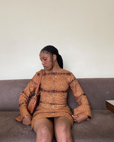 Black girl in a long sleeve short orange Ankara dress with black braids and an orange shoulder bag Long Sleeve Ankara Dress, Gown Long Sleeve, Ankara Short, Dress Ankara, African Wear Dresses, Short Gowns, Ankara Dress, Long Sleeve Short Dress, African Wear