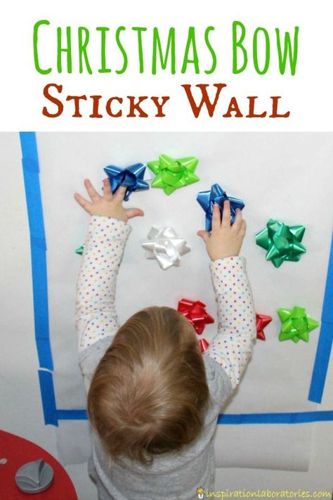 A Christmas bow sticky wall is the perfect activity for toddlers. Practice fine motor skills, colors, patterns, and keep them entertained! Toddler Christmas Craft, Christmas Activities For Toddlers, Sticky Wall, Infant Classroom, December Activities, Activity For Toddlers, Christmas Craft Ideas, Christmas Crafts For Toddlers, Daycare Activities