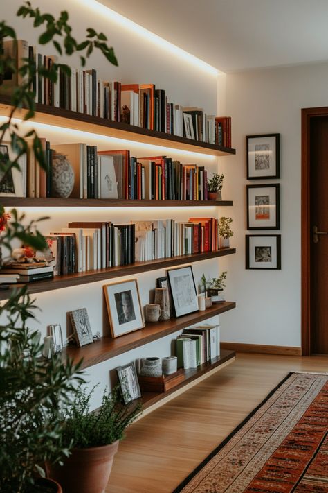 Turn your home office into a cozy home library with these tips and design ideas. Library Wall Styling, Wall Shelf Library, Beachy Home Library, Floating Shelves Library Bookshelves, Library Room Minimalist, Den Library Ideas, Library In The Bedroom, Small Home Office And Library, Book Shelf Diy Wood