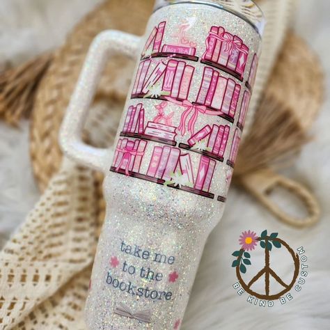 Take me to the bookstore.. 📖 This 40 ounce handled tumbler features a beautiful pink themed book shelf pattern over a cream colored opal glitter. Perfect for the book girlies! Decals from @swearykim (Code bekind) #40ounce #epoxytumbler #customtumbler #glittertumbler #tumblersofinstagram #booklover #bookclub #book Book Themes, Functional Art, Drinking Water, Custom Tumblers, How To Stay Motivated, Cream Color, Thoughtful Gifts, Book Lovers, Beautiful Design