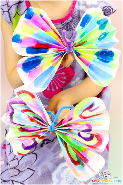 Transform your child's artwork into vibrant paper butterflies with this easy and fun craft! Perfect for preschoolers, this project uses simple accordion folds and a pipe cleaner to create beautiful butterflies. Great for recycling art and enhancing fine motor skills. Follow our step-by-step guide and explore more butterfly crafts at Arty Crafty Kids! 🦋 #KidCrafts #ButterflyCrafts #PreschoolActivities #RecycledArt #FineMotorSkills Pre K Butterfly Crafts, Pipe Cleaner Art For Kids, Butterfly Preschool Craft, Butterfly Crafts For Toddlers, Butterfly Art For Kids, Pipe Cleaner Butterfly, Easy Butterfly Craft, Butterfly Art Project, Pipe Cleaner Crafts For Kids