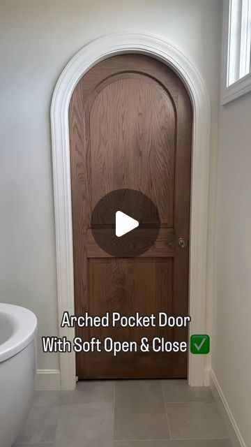 Scott & Britney Anderson • Affordable Home Inspiration on Instagram: "A soft open/close ARCHED door?!! 🤯 what more could you ask for? 

Want to know @cardinalcrestkc ‘s secret? 

Although the door panel has an arched detail, the door top itself is square. The trim around it is arched to make the door appear arched. 

#pocketdoor
#archdoor
#archdoorway
#homielovin 
#homieinspo 
#builderssecret 
#bathroomdoor" Rounded Pocket Doors, Faux Arched Door, Black Arched Door, Fluted Glass Arch Door, Arched Bathroom Door, Arched Pocket Doors Interior, Arch Pantry Door, Arched Doors Interior, Arched Pocket Doors