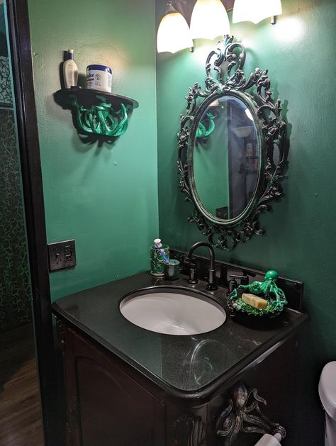 From reddit https://www.reddit.com/r/WitchesVsPatriarchy/comments/wdqr0z/i_love_how_my_bathroom_remodel_turned_out_if_i/ Goblincore Bathroom Aesthetic, Octopus Bathroom Decor Ideas, Dark Mermaid Bathroom Decor, Gothic Nautical Bathroom, Gothic Ocean Bathroom, Gothic Green Bathroom, Victorian Gothic Bathroom Ideas, Goth Nautical Decor, Witchy Bathroom Decor Ideas