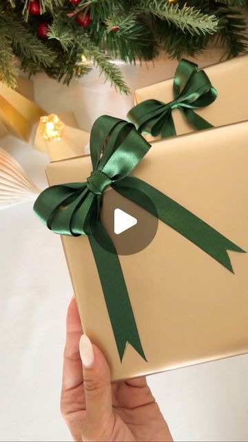 Chantel Mila Ibbotson on Instagram: "Turn your extra ribbon into these gorgeous bows 🎁 this trick is so quick + easy and is the perfect finishing touch on your gifts ♥️ save this video for when you start gift wrapping! Are you an early shopper, or do you leave it to the last minute? 🎄gold wrapping paper from @kikki.k #christmas #christmasdecor #christmastime #christmasmood #giftwrapping #giftwrappingideas #tipsandtricks #mamamilastips #hometips #homehacks" Velvet Bow Gift Wrap, Bow Present Ribbon, Gift Wrap Bow Ideas, Gift Wrapping Bow Ideas, Ribbon On Christmas Presents, How To Wrap Presents With Ribbon, How To Make Gift Bows With Ribbon, Ribbon Present Wrapping, Gift Box Bow Diy Ribbons