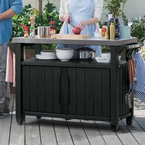 Elevate your entertaining game with our Bar Cart, crafted from durable wood-look resin and featuring a stainless steel countertop. The perfect blend of style and function. Explore now! Click the Link and get yours TODAY! (This post may contain affiliate links.) Outdoor Patio Bar Sets, Outdoor Storage Units, Stainless Steel Countertop, Mobile Kitchen Island, Steel Countertop, Bar Serving Cart, Bbq Table, Outdoor Patio Bar, Serving Trolley