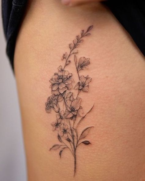 Montreal fineline SoSo on Instagram: "Birth month family bouquet for Maggie 🥰 marigold, carnation, larkspur and gladiolus flower 🌹   Note 📝  Tattoo on the ribs can hurt !  . . . . #flowerbouquettattoos #finelinebouquettattoos #montrealflorist #marigoldtattoo #larkspurtattoo #gladiolustattoodesign #carnationtattoo #metrixtattooneedles" Marigold Tattoo Ribs, Carnation Daisy Marigold Tattoo, Crape Myrtle Tattoo, Larkspur And Marigold Tattoo, Narcissus And Gladiolus Flower Tattoo, Marigold Tattoos For Women, Waterlily Larkspur Tattoo, October And April Birth Flower Tattoo, Marigold Rib Tattoo