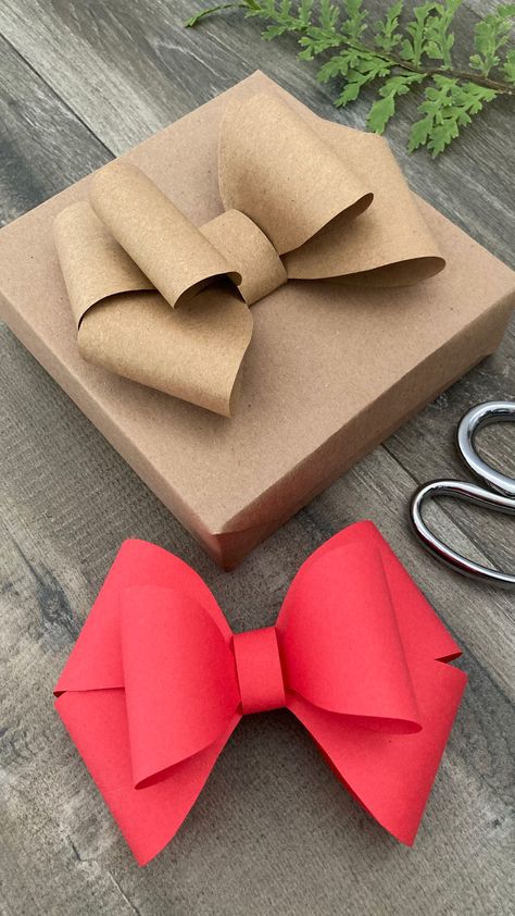 Add a touch of handmade charm to your gifts with a spectacular paper bow! Full video viewable through link. ❤️ . . . #paperbow #diybow #papercrafts #christmas #christmascrafts #bow Diy Gifts Wrapping Ideas, Wrapping With Craft Paper, Wrapping A Large Gift Ideas, How To Make A Bow Out Of Tissue Paper, Paper Bows Diy Templates, Making Paper Bows, Bow On Present Wrapping, Gift Wrapping With Newspaper, Present Toppers Diy