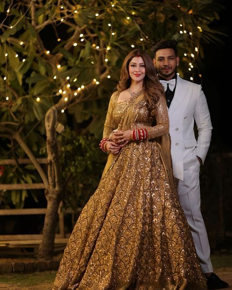 Keeping it gold @bsonarika for her wedding reception. #weddingseason #viralreels #weddingviral #viralbride #viralwedding #weddingphotography #wedding #weddingdress #weddingday #weddings #wreceptionlehenga #goldenlehenga #bridegroom #couplegoals #couple #couples #couplevideos #marriage #marriagetip #shadi #shadiseason #reelsinstagram #trending #trend #wishnwed #shaadi ( tellybride, viral wedding video, groom squad, devokedevmahadev, indian bridal entry, receptiondress , fishtail cut lehenga... Gold Bridal Lehenga Wedding Bride, Golden Lehnga Makeup Look, Reception Look For Indian Bride, Reception Look Indian Couple, Golden Lehenga Brides Receptions, Golden Reception Lehenga, Indian Bride Groom Outfits, Couple Reception Look, Lehanga For Reception Bridal Couple