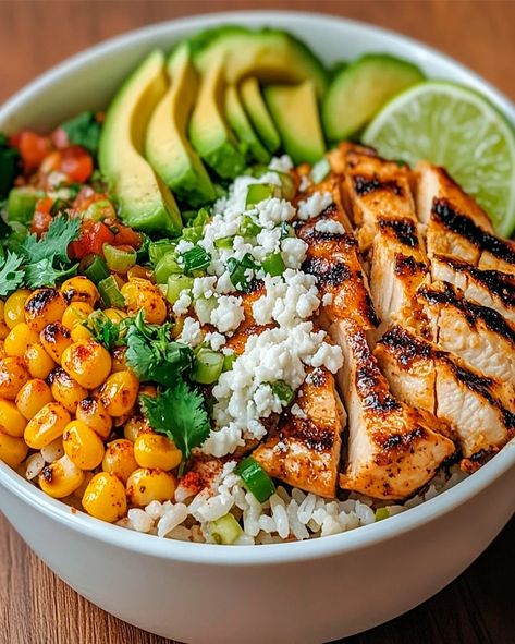 Learn how to make this easy Street Corn Chicken Rice Bowl with grilled chicken, cilantro-lime rice, and creamy street corn. A perfect meal Corn Chicken Rice Bowl, Cilantro Lime Chicken Rice Bowl, Chicken Mexican Street Corn Bowl, Rice Bowl Ideas Chicken, Chicken And Rice Protein Bowl, Yummy Bowl Recipe, Grilled Chicken Rice Bowl, Mexican Street Corn Chicken Bowl, Street Corn Chicken Rice Bowl Recipe