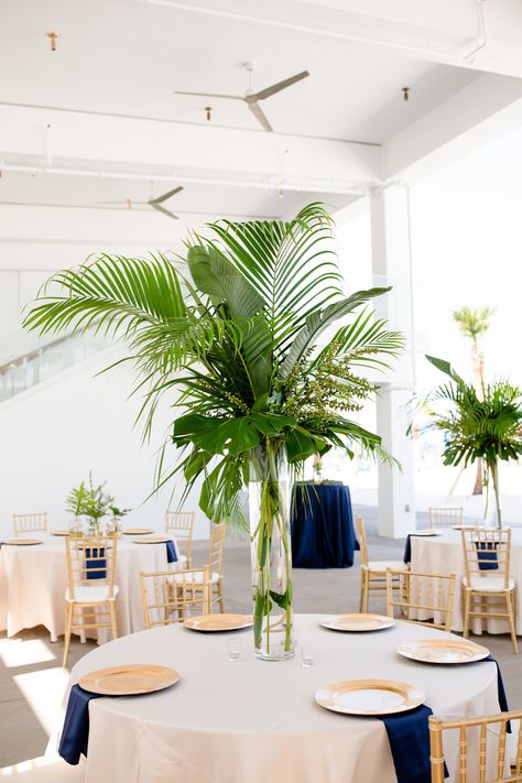 Paper Palm Centerpiece, Palm Frond Centerpiece, Tropical Table Centerpieces Diy, Palm Leaf Table Decor, Wedding Table Tropical, Palm Table Decor, Tropical Round Table Decor, Palm Frond Floral Arrangement, Navy Blue And White Wedding Decorations