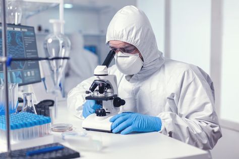 Free Photo | Microbiologist with protection glasses using microscope dressed ppe suit Microbiology Lab, Pharmaceutical Manufacturing, Research Scientist, Regulatory Compliance, Pharmaceutical Industry, Biochemistry, Microbiology, Biotechnology, Medical School