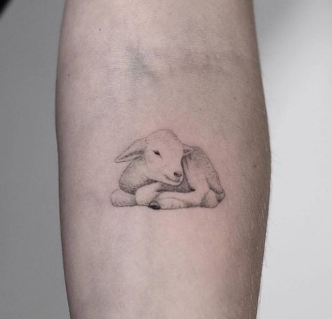 Lil' lamb tattoo on the left inner forearm. Realistic Sheep Tattoo, Realistic Lamb Tattoo, Sheep Tatoos Ideas, Sleeping Lamb Tattoo, One Lost Sheep Tattoo, Black Lamb Tattoo, Lamb Head Tattoo, Lamb Outline Tattoo, Lamb Tatoos