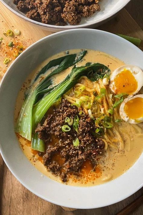 A serving of tantanmen ramen in a white bowl with ramen noodles topped with spicy minced meat, baby bok choy, one jammy ramen egg sliced in half, and garnished with green onions, sesame seeds and shichimi togarashi. On the side is another white bowl with more spicy minced meat. Simple Ramen Recipes, Creamy Ramen Recipe, Tantanmen Ramen Recipe, Tantan Ramen, Healthy Ramen Recipes, Tantanmen Ramen, Creamy Ramen, Tan Tan Ramen, Easy Asian Noodle Recipes