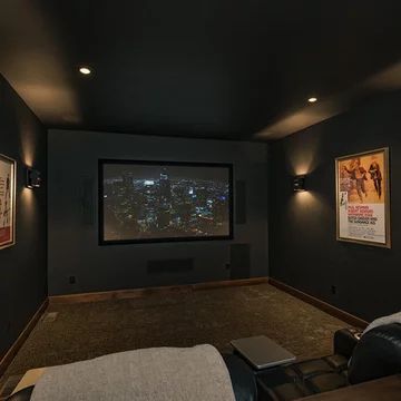 Black Wall Movie Room, All Black Media Room, Movie Theater Paint Colors, Home Theatre Painting Ideas, Theatre Living Room Ideas, Navy Blue Theater Room, Black Home Theater Room, Home Theater Accent Wall, Simple Theater Room Ideas